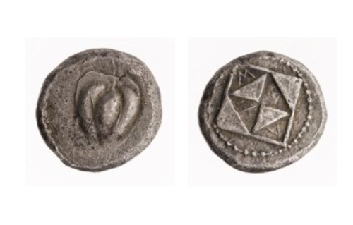 Silver stater of Melo featuring an apple on the obverse and square divided into triangles on the reverse.