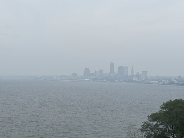 Canadian wildfire smoke causes an afternoon haze on August 4, 2025, obscuring the view of Lake Erie and downtown Cleveland, Ohio. Photograph by John K. Jones